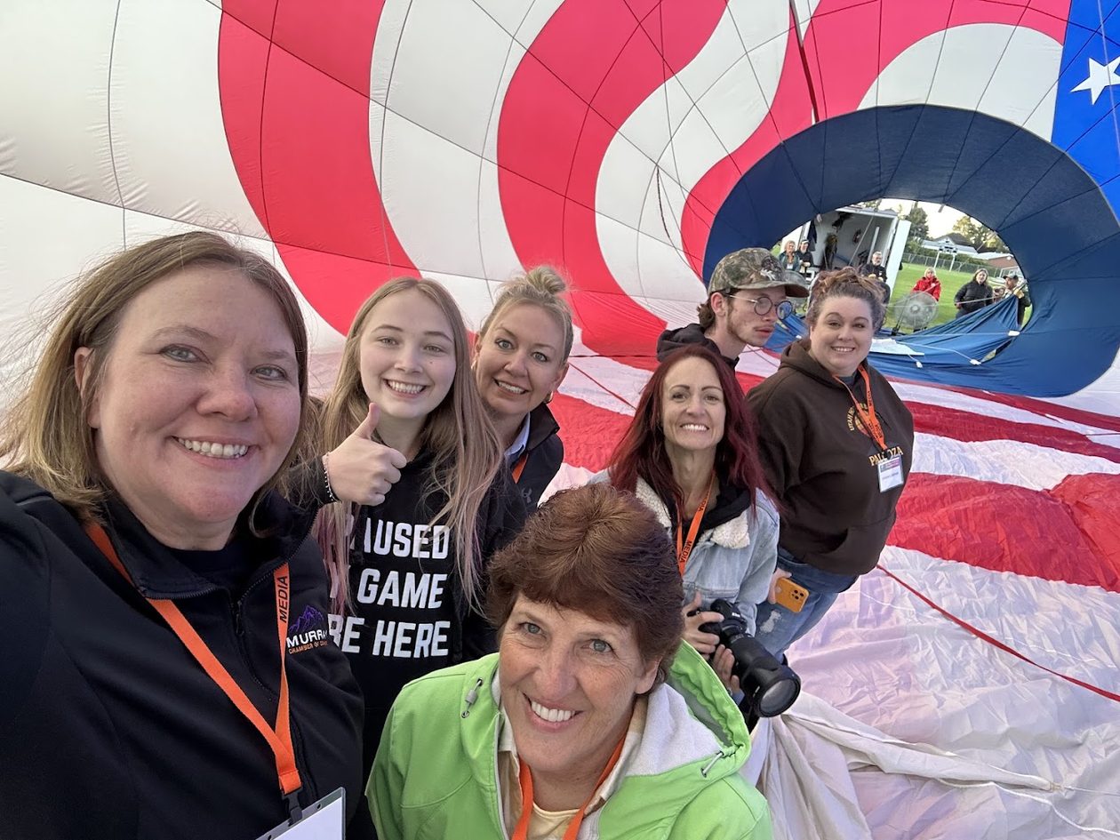 Magic Over Murray volunteers inside a balloon envelope at the festival